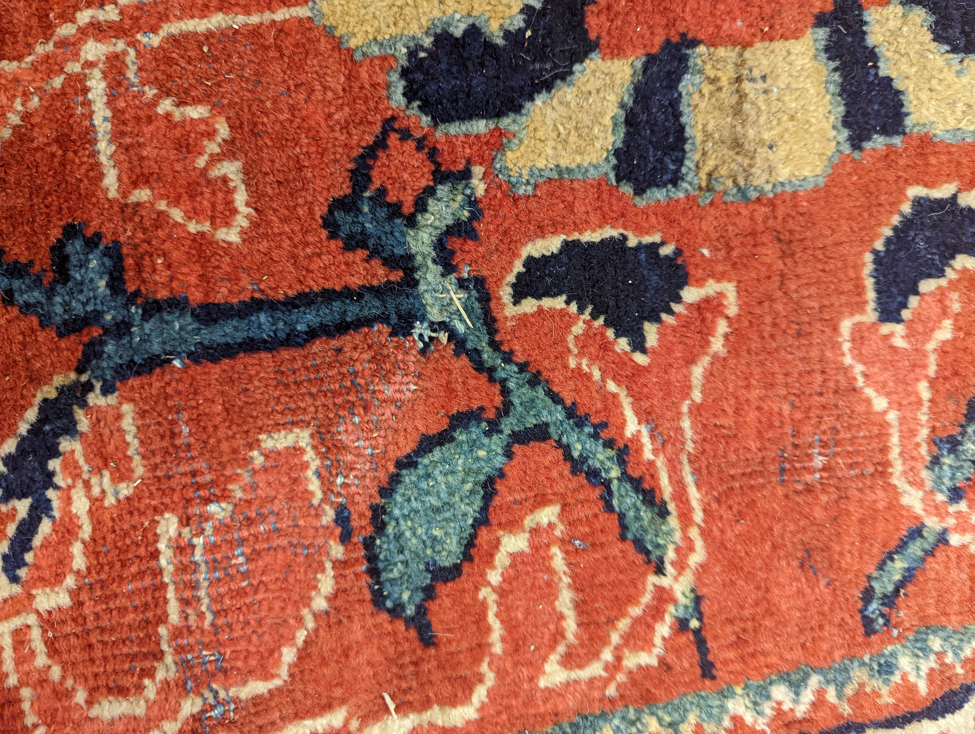 A Heriz brick red ground carpet, 364 x 280cm